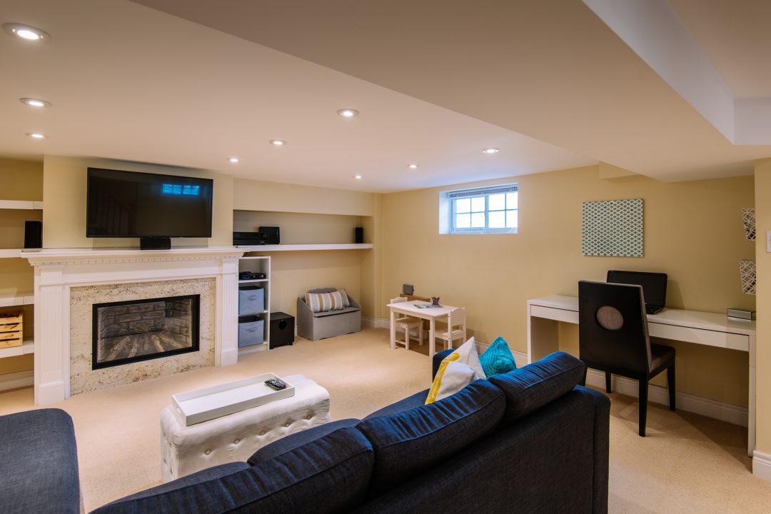 Interior of modern renovated lover floor basement common room in private city  residence.